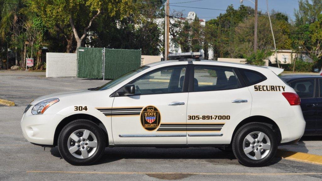 white 50 state security car with yellow and black font design