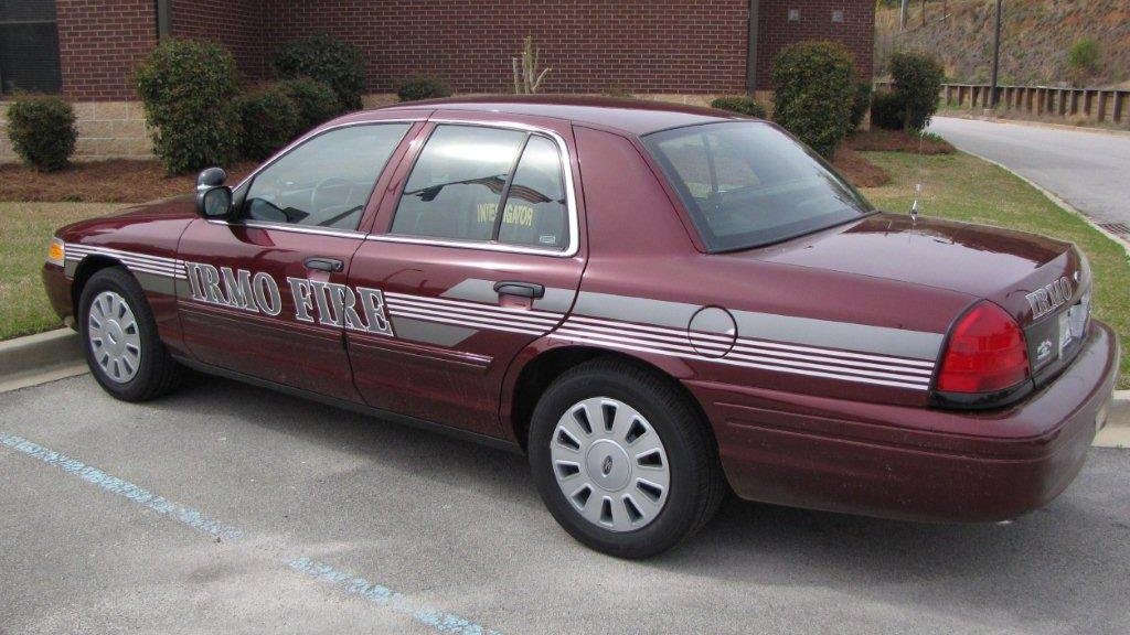 sideview of a red designed irmo fire car