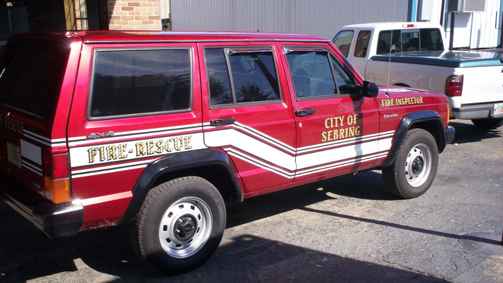 red sebring fire rescue car with white line design