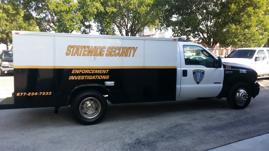 statewide security truck with yellow and black design