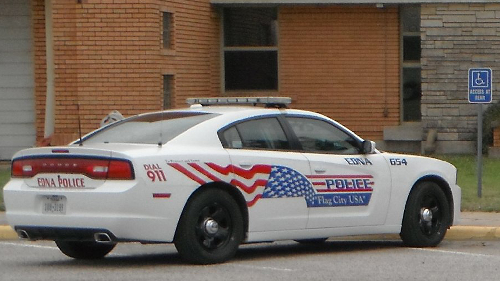 white police car with USA flag design