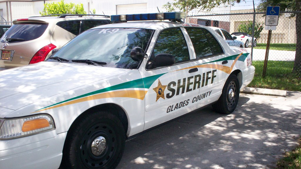 glades sheriff white car with green and yellow line design