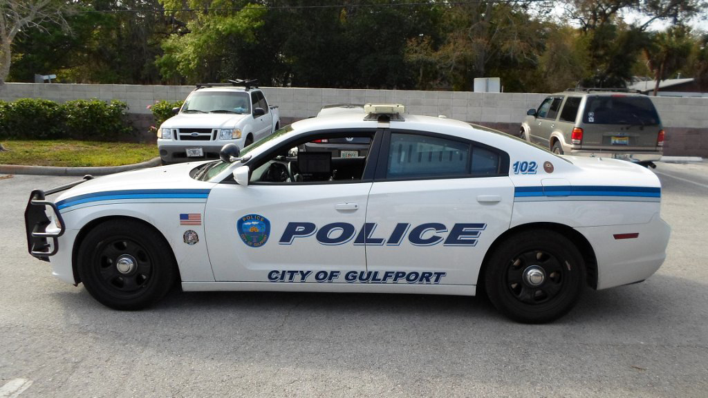 white gulfport police car with logo of USA