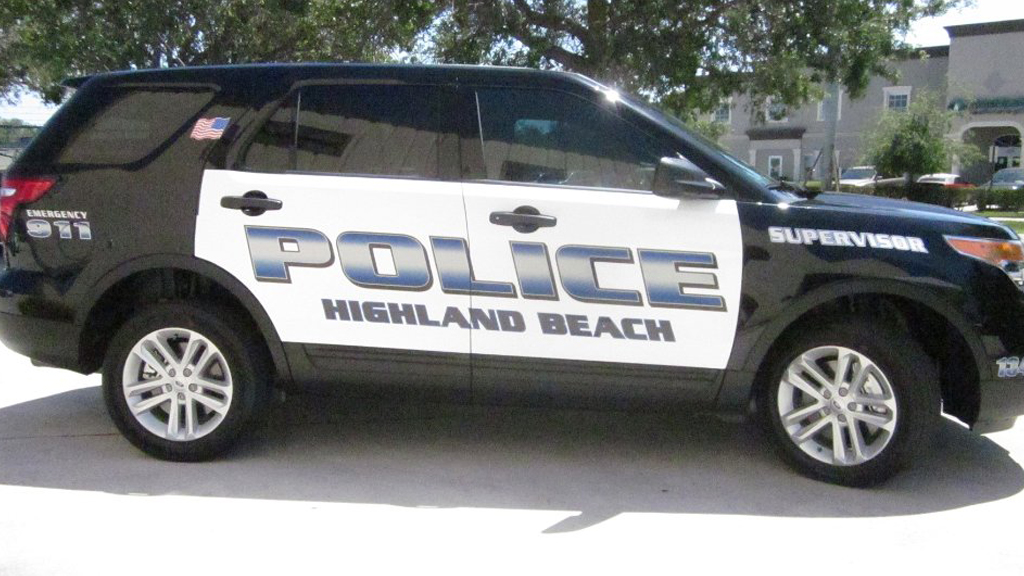 black highland beach police car with blue and white font color design
