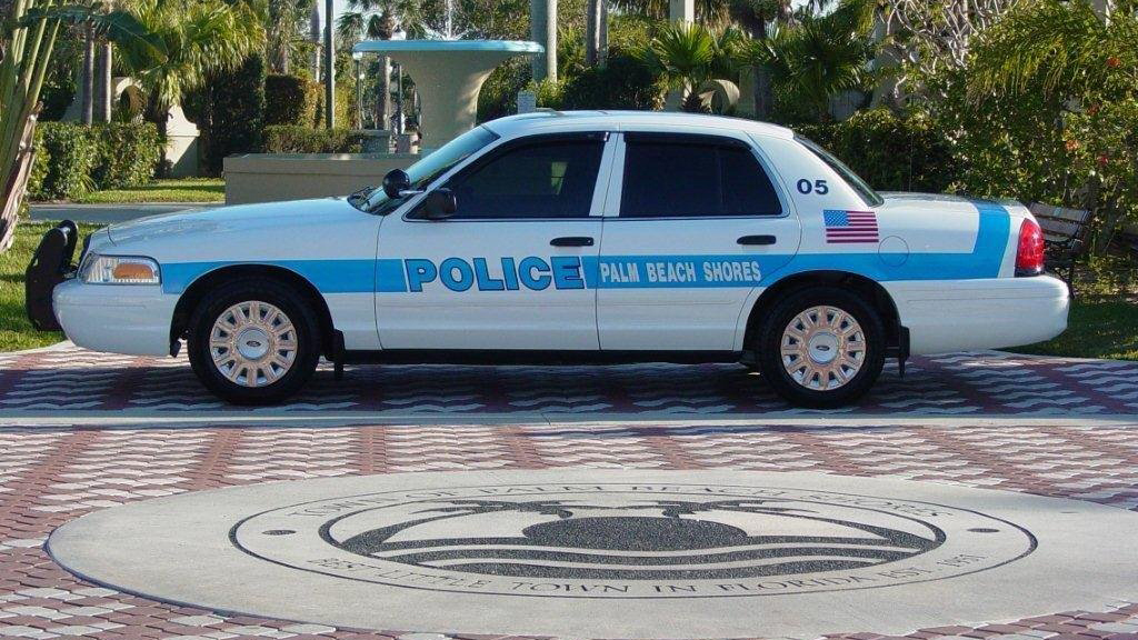 sky blue and white palm beach police car