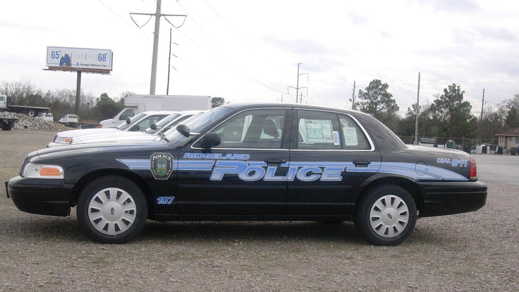 black ridgeland police car with logo and blue line design