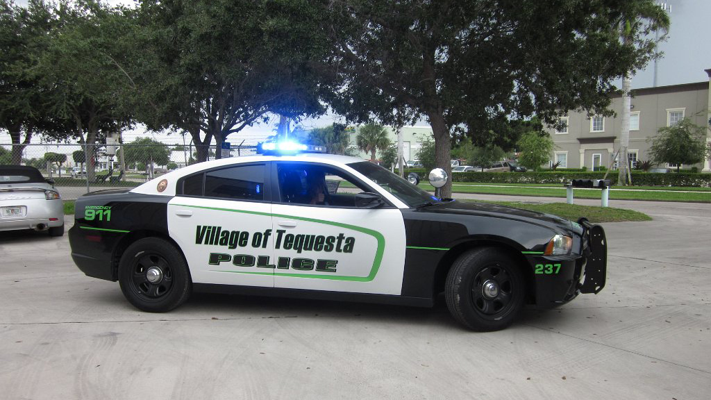 black, white and green design of tequesta police car