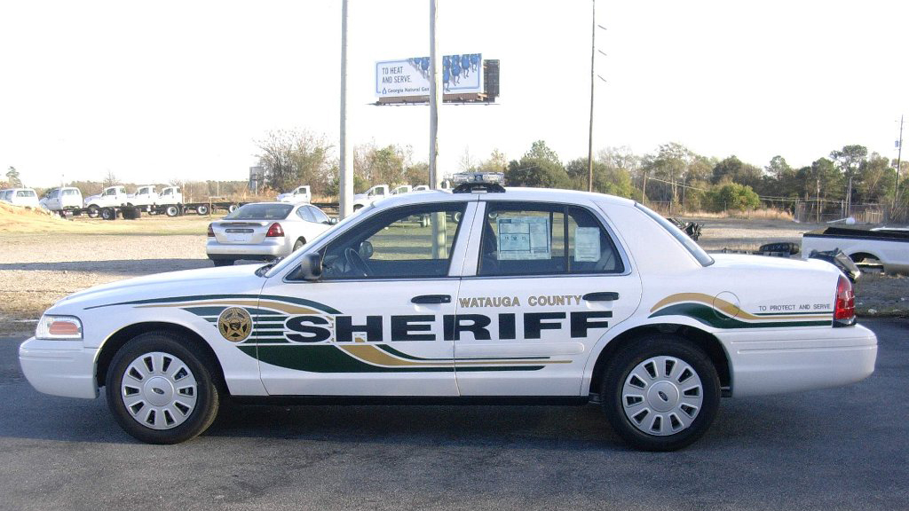watauga sheriff white car with logo, gold and black line color design