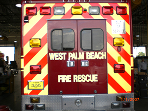 back of west palm beach fire rescue truck with yellow and red line design